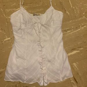 An adorable white tank top with front closure